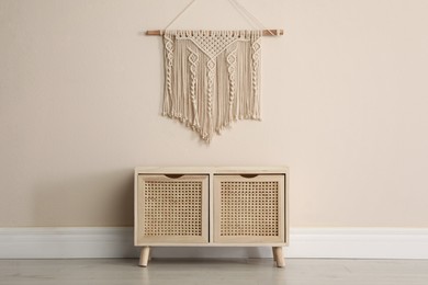 Photo of Wooden chest of drawers and decor indoors