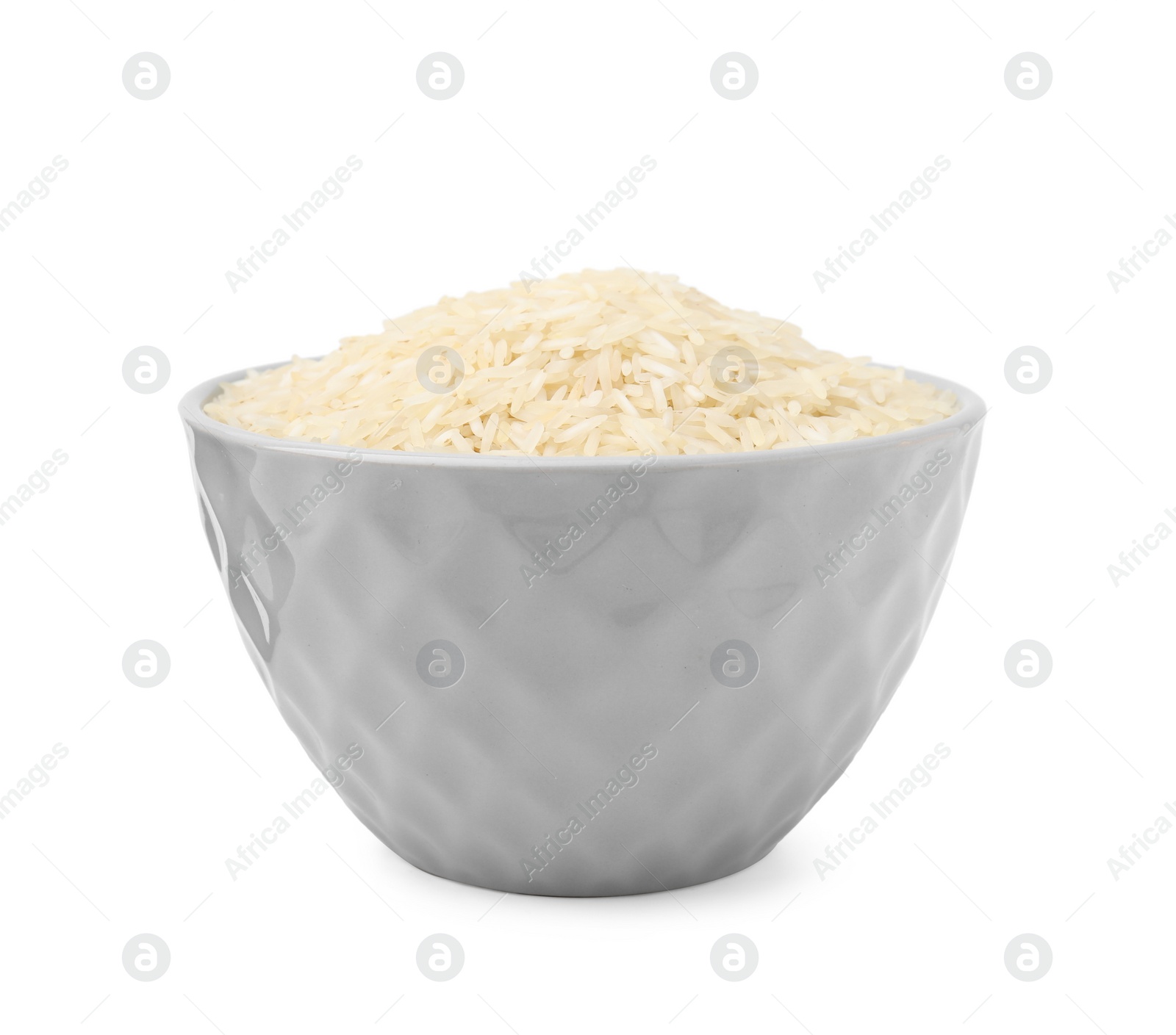 Photo of Raw rice in bowl isolated on white