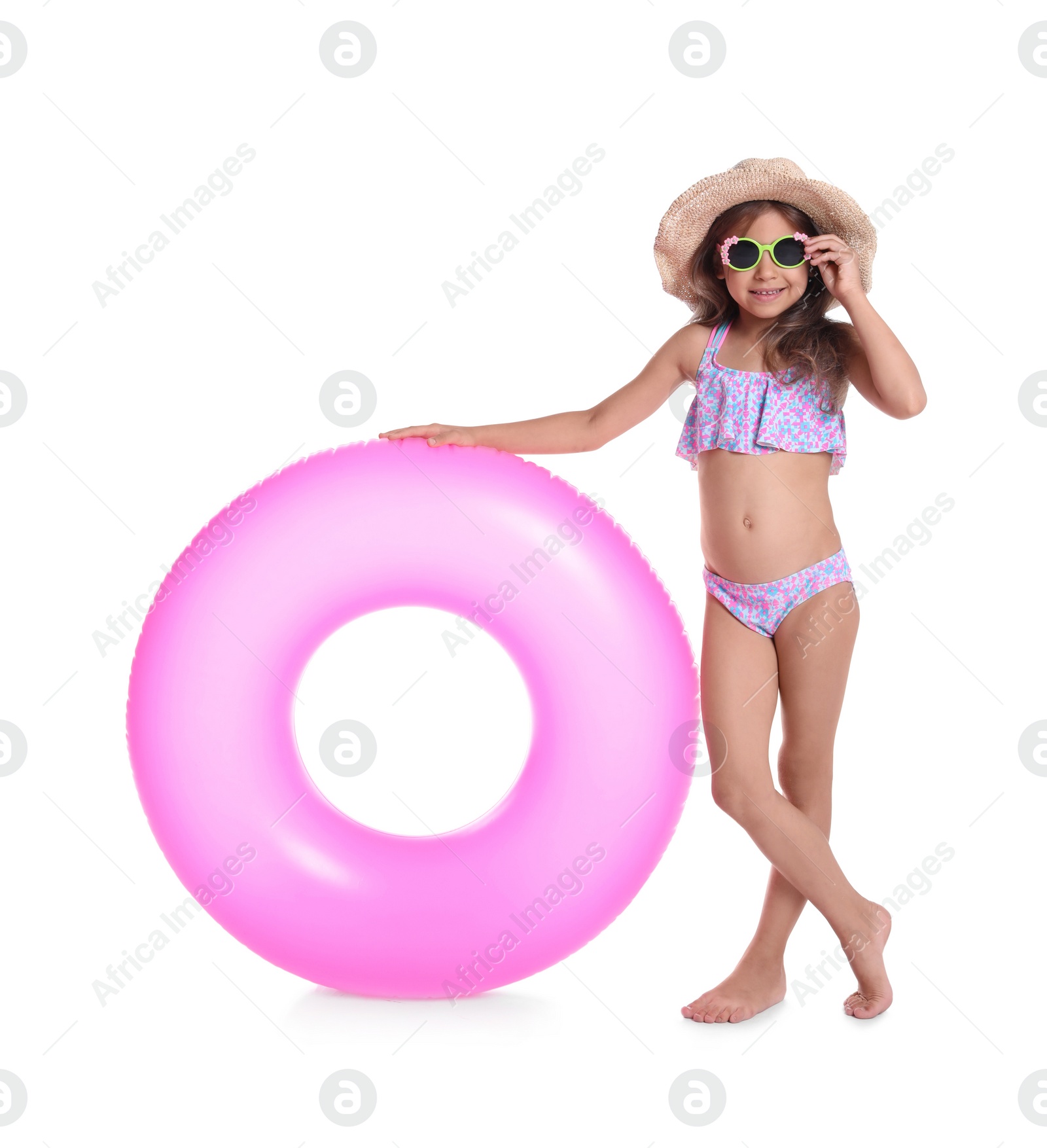 Photo of Cute little girl with inflatable ring on white background