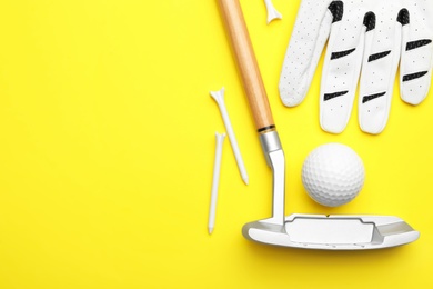 Set of golf equipment on color background, flat lay. Space for text