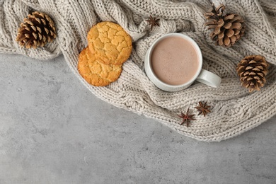 Photo of Composition with delicious hot cocoa drink and cookies on grey background, flat lay