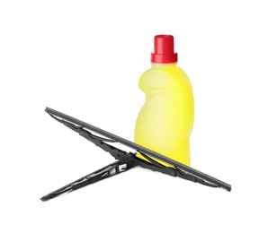 Photo of Bottle of windshield washer fluid and wipers on white background