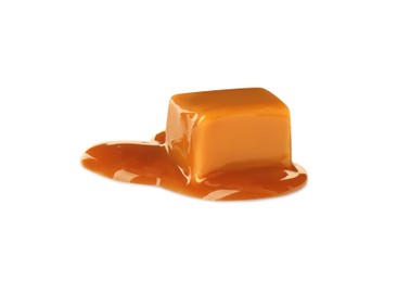 Photo of Sweet caramel candy with topping isolated on white