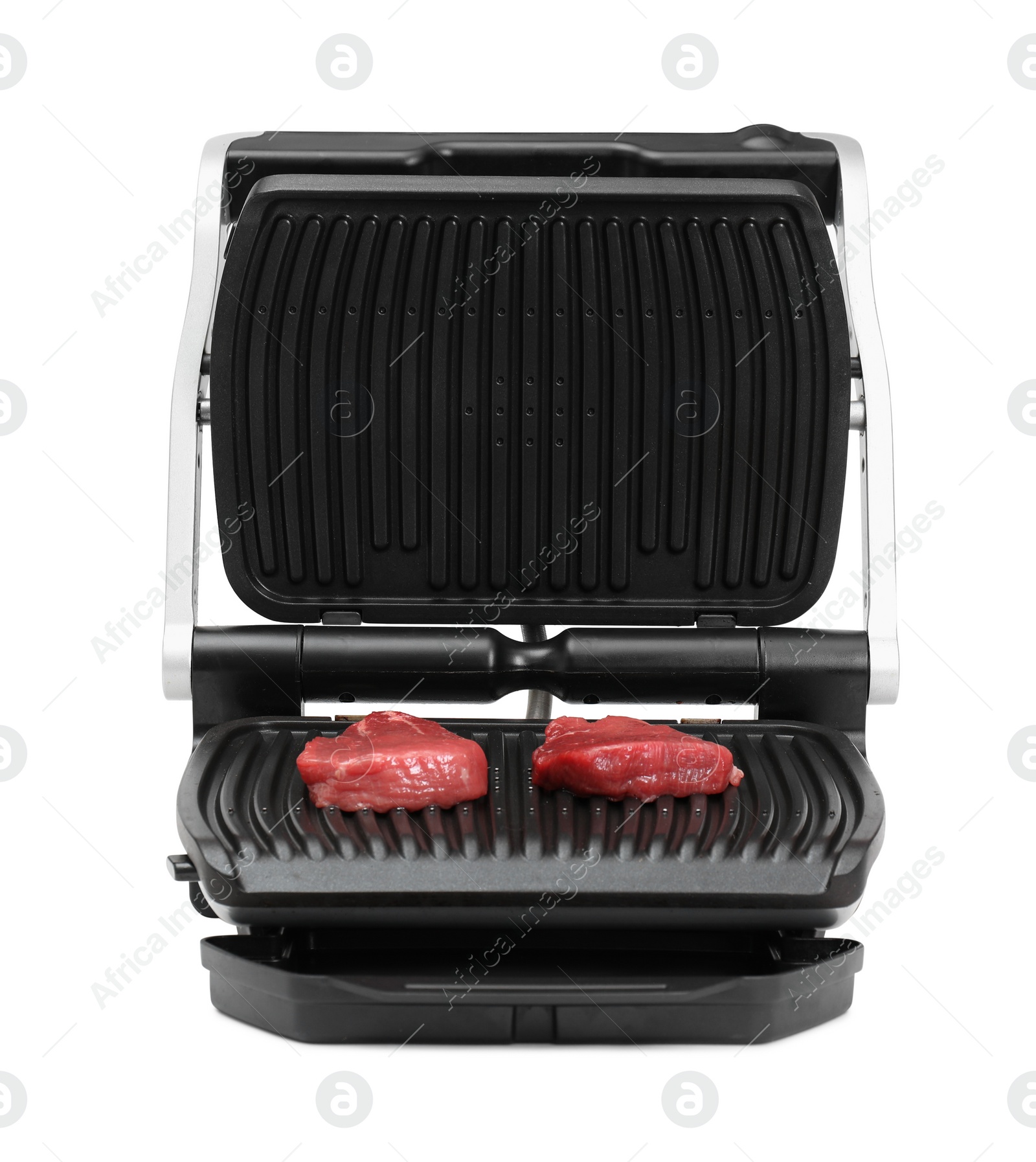 Photo of Electric grill with raw meat steaks isolated on white