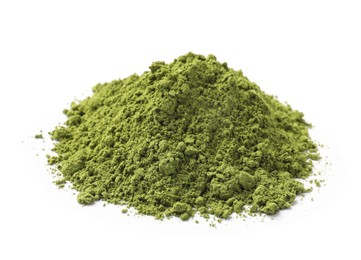 Photo of Pile of green matcha powder isolated on white