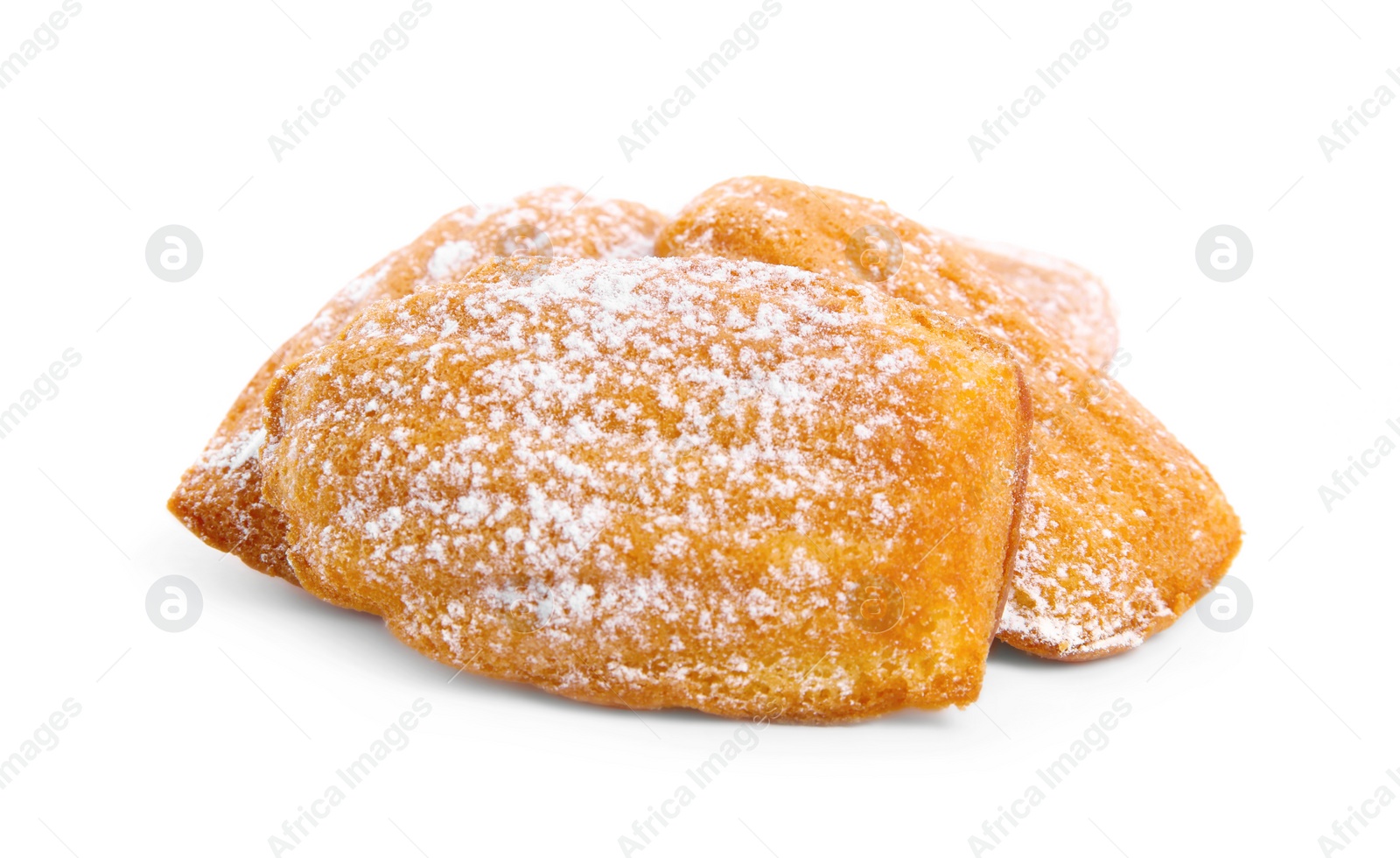 Photo of Delicious madeleine cakes with powdered sugar on white background