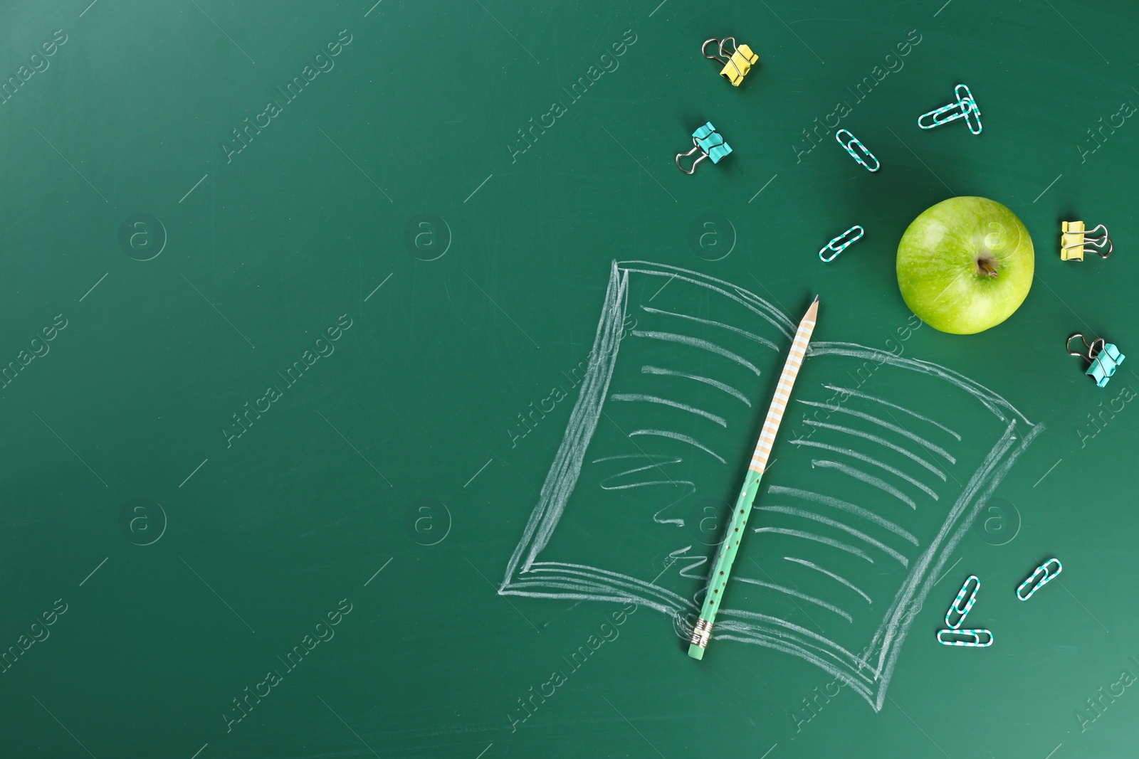 Photo of Flat lay composition for Teacher's day on chalkboard