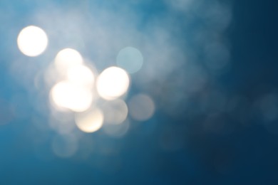 Photo of Shiny blue background with magical bokeh effect