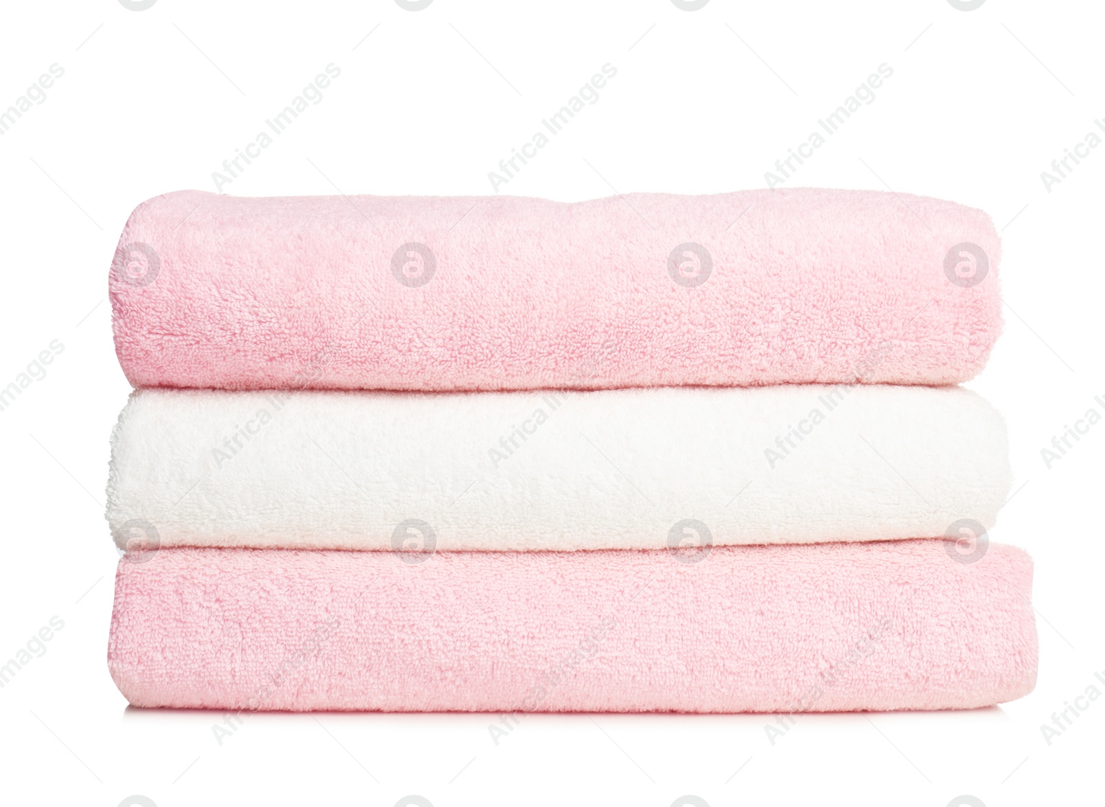 Photo of Folded soft terry towels on white background