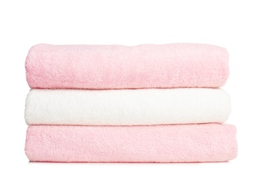 Photo of Folded soft terry towels on white background