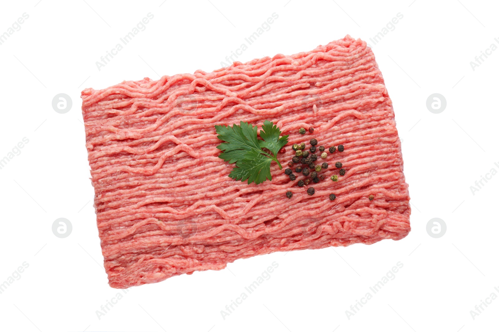 Photo of Raw fresh minced meat with parsley and pepper isolated on white, top view