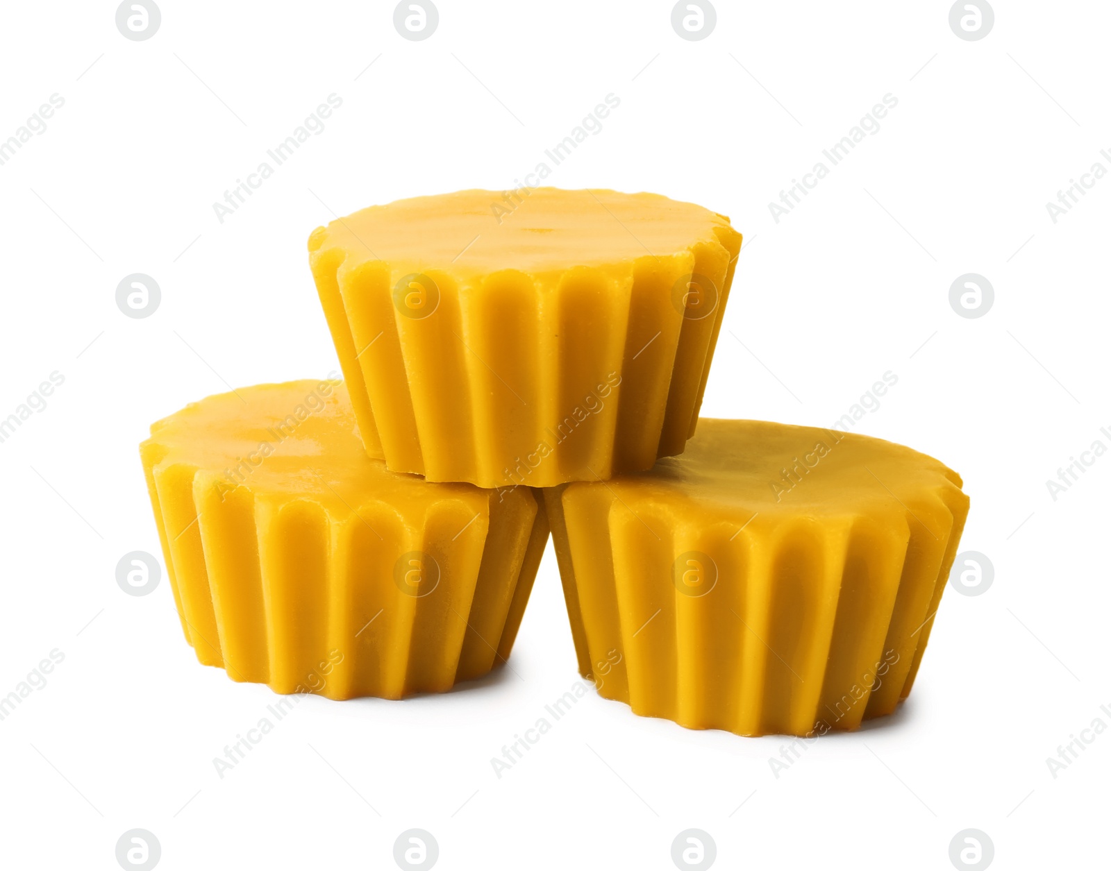 Photo of Natural beeswax cake blocks on white background