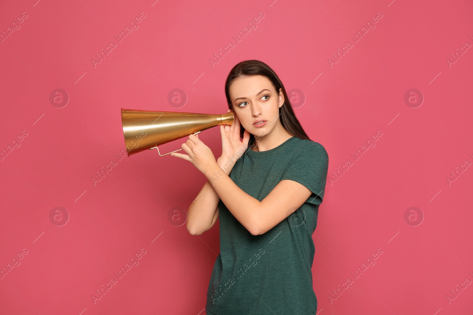 Photo of Young woman with megaphone on color background