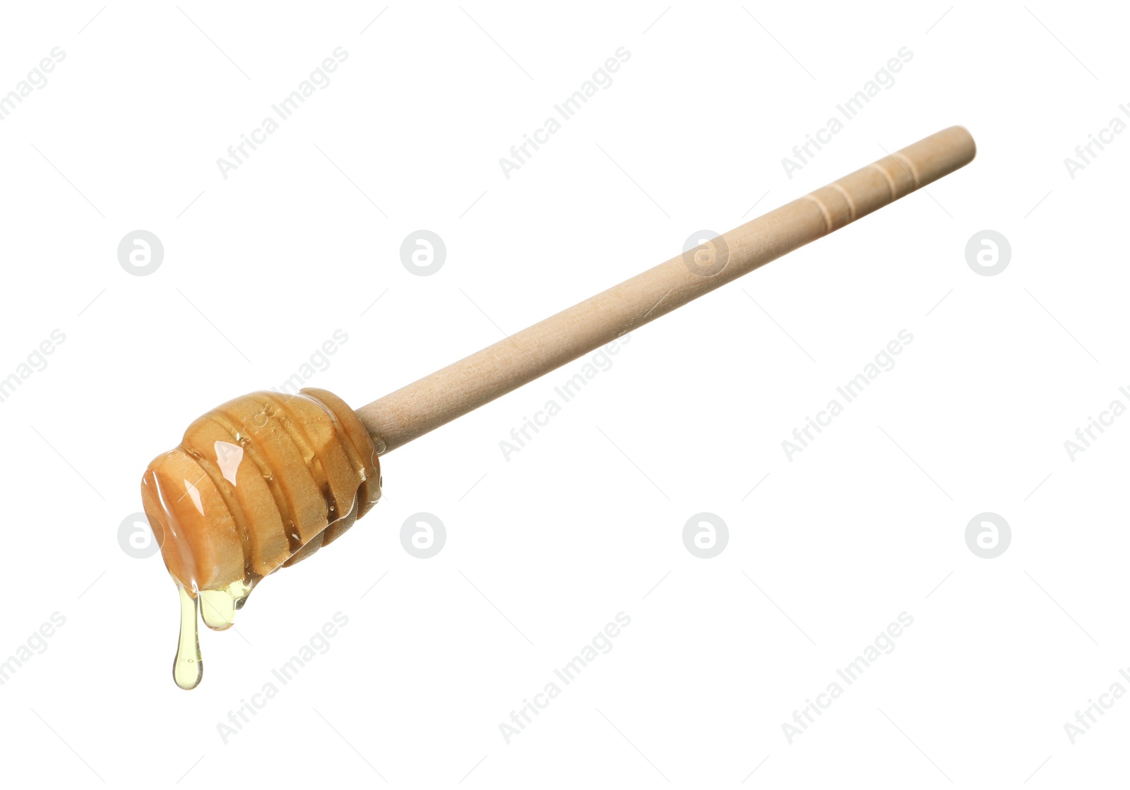 Photo of Natural honey dripping from dipper on white background