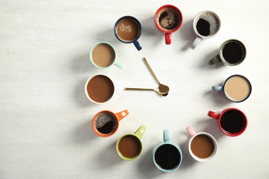 Flat lay composition with cups of coffee on light background. Food photography