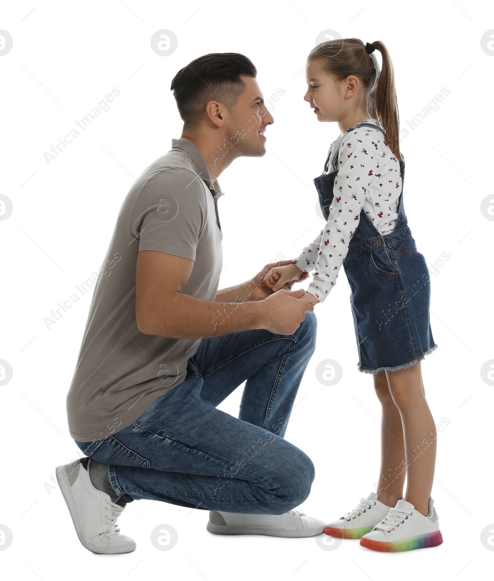 Photo of Little girl with her father on white background