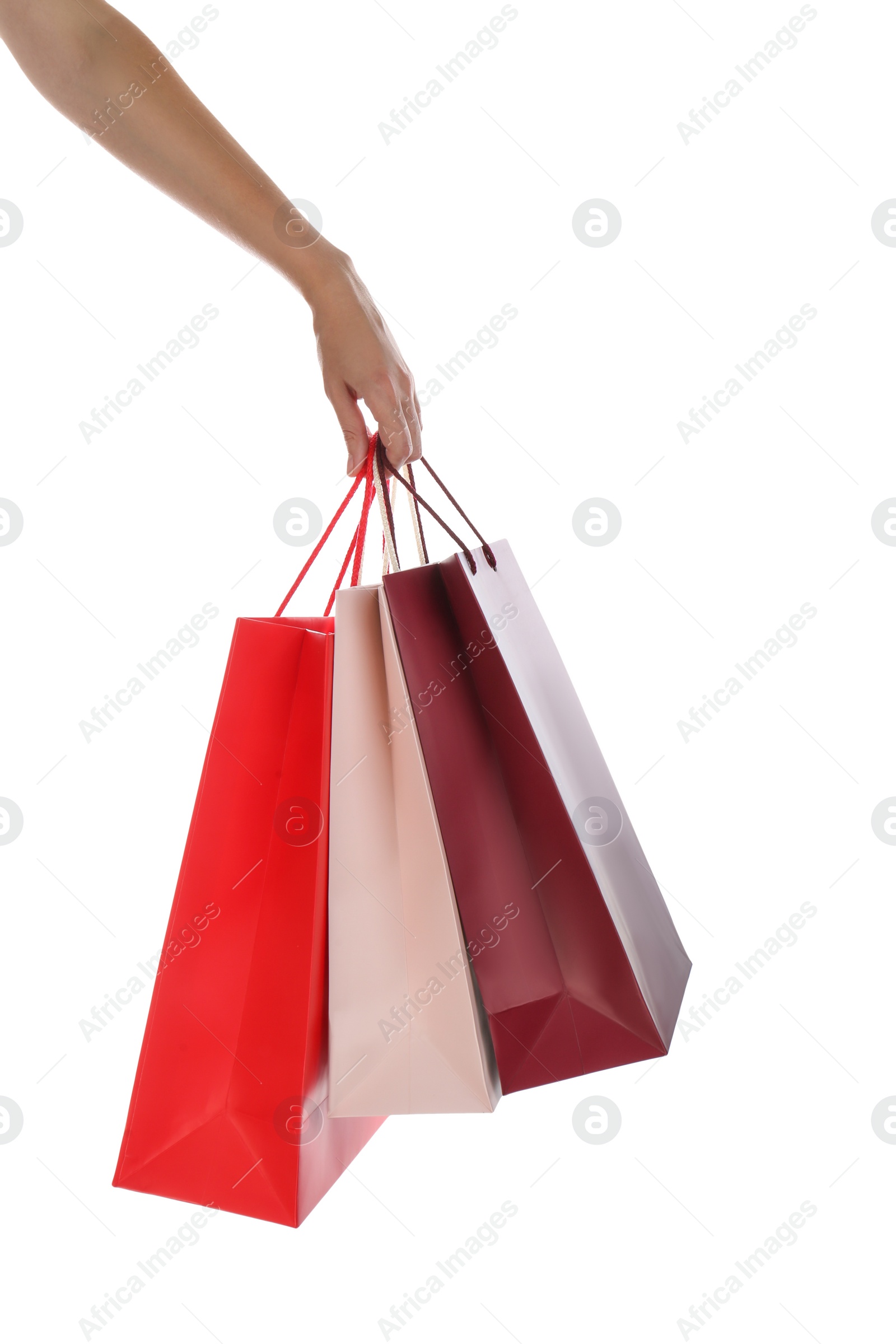 Photo of Woman with paper shopping bags on white background, closeup