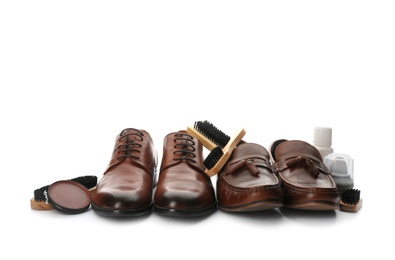 Photo of Stylish footwear and shoe care products on white background