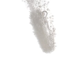 Photo of Effervescent pill dissolving in water on white background, closeup