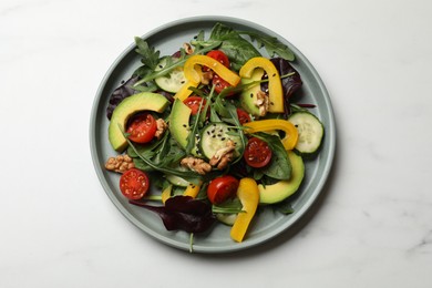 Balanced diet and vegetarian foods. Plate with different delicious products on white marble table, top view