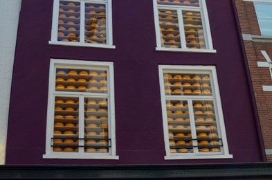 Photo of Exterior of shop with many cheese wheels on display