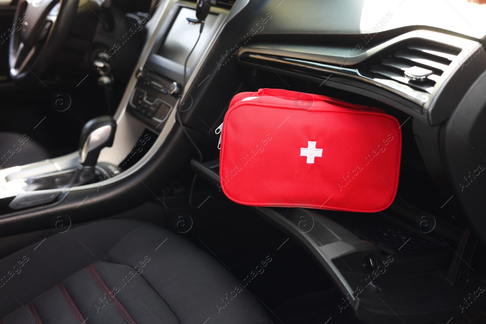 Photo of First aid kit with medicaments inside car