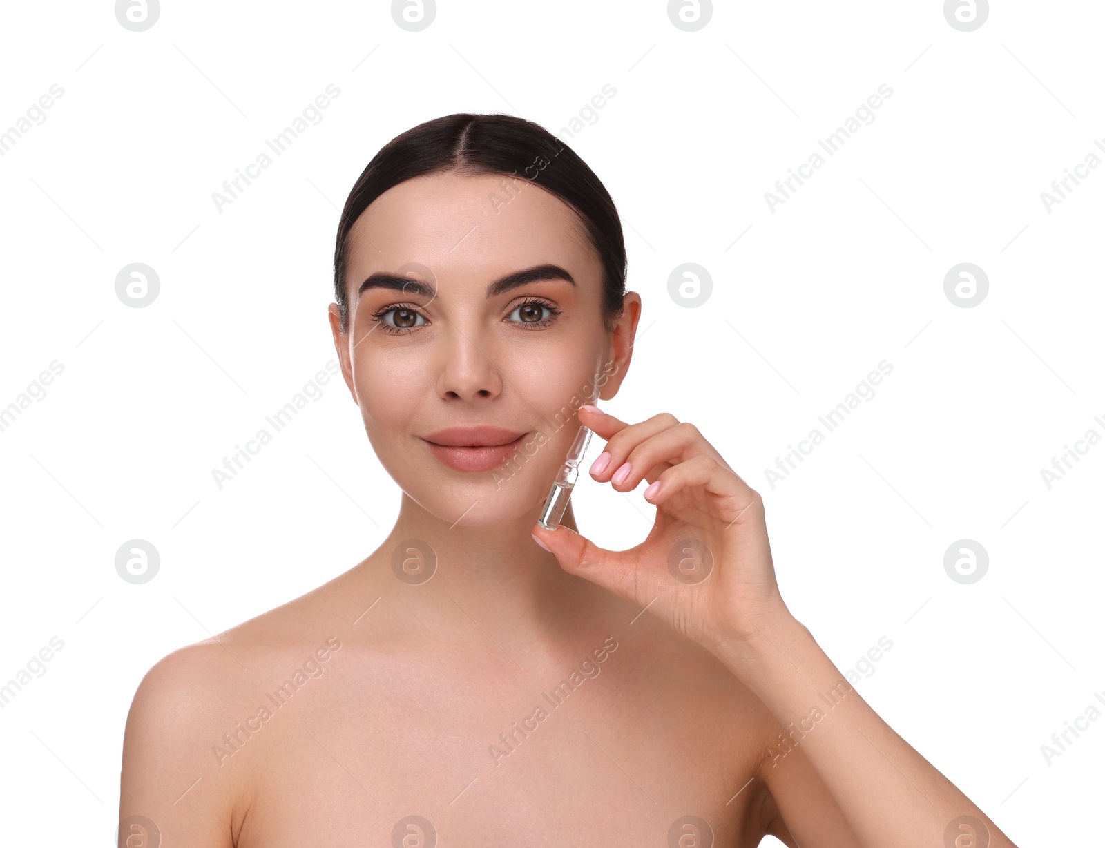 Photo of Beautiful young woman holding skincare ampoule on white background