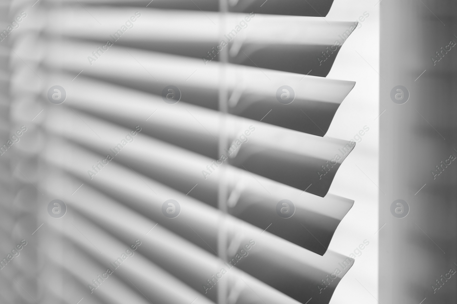 Photo of Closeup view of stylish horizontal window blinds