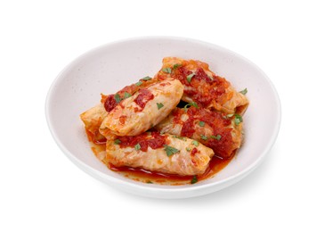 Photo of Plate of delicious stuffed cabbage rolls cooked with homemade tomato sauce isolated on white,