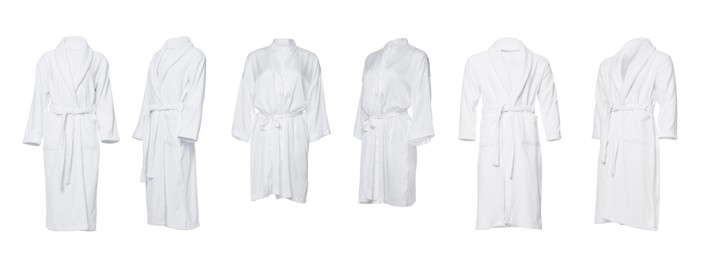 Set of different bathrobes on white background