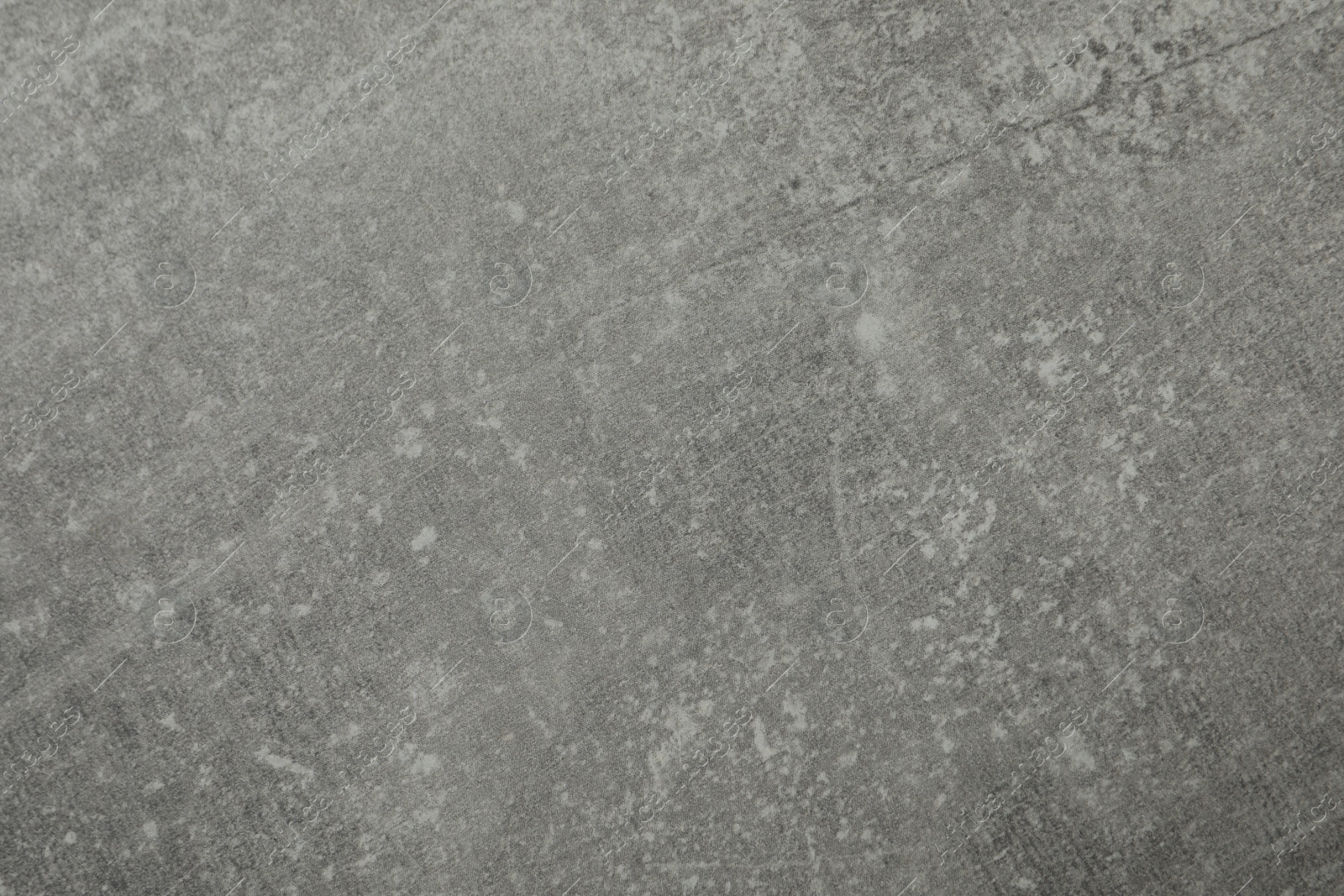 Photo of Texture of light grey stone surface as background, closeup