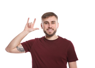 Photo of Man showing I LOVE YOU gesture in sign language on white background