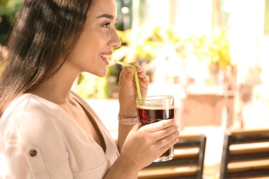 Photo of Beautiful woman with cold kvass outdoors. Traditional Russian summer drink