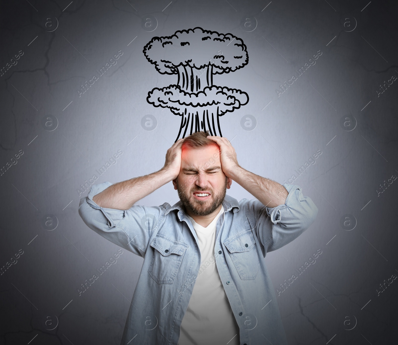 Image of Young man having headache on light grey background. Illustration of atomic explosion representing severe pain