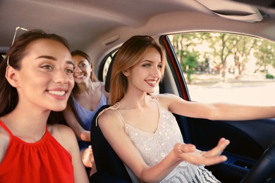 Photo of Happy beautiful young women together in car