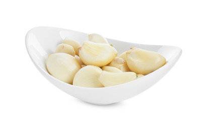 Photo of Peeled garlic cloves in bowl isolated on white