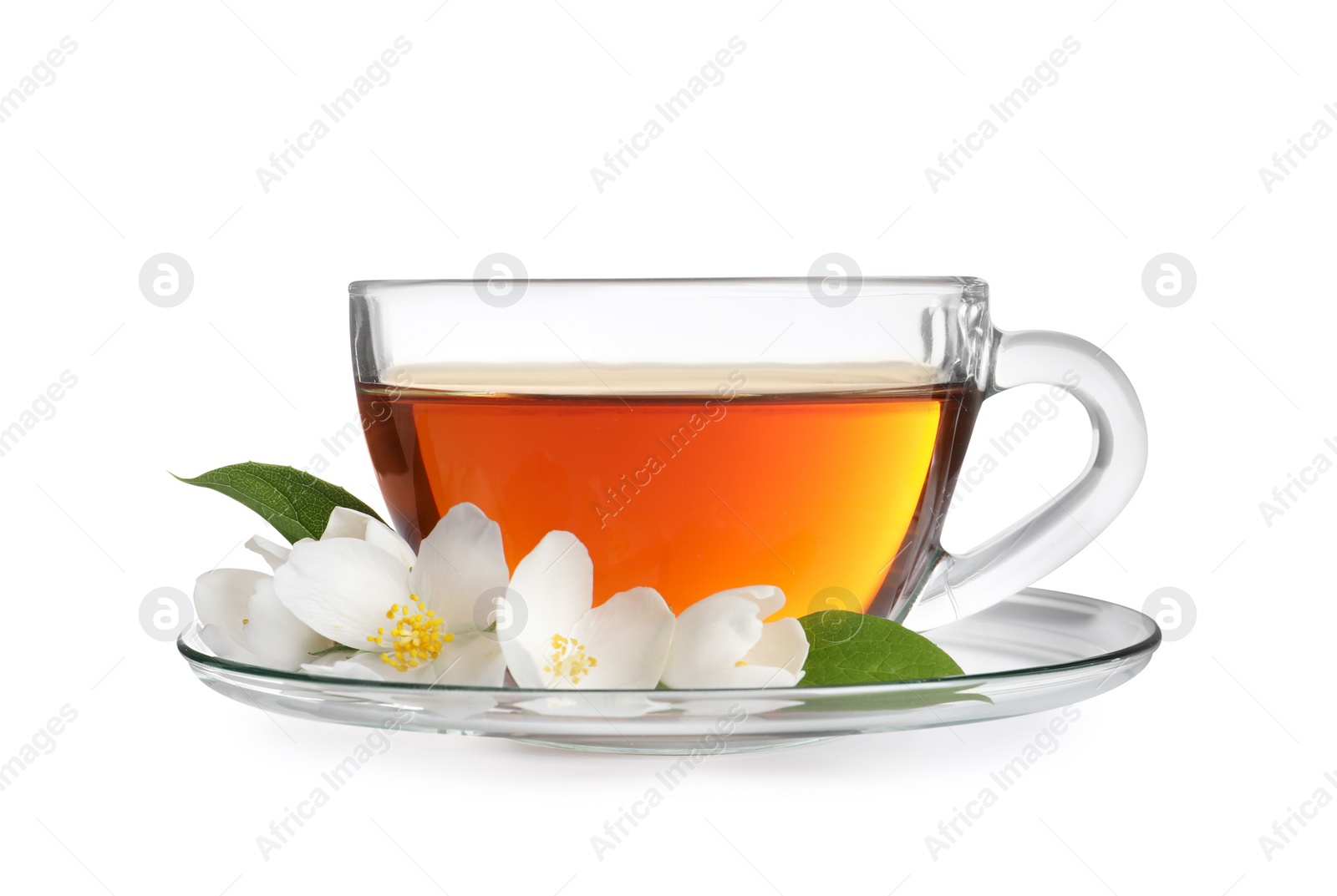 Photo of Glass cup of aromatic jasmine tea and fresh flowers on white background