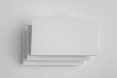 Photo of Blank business cards on white background, top view. Mock up for design