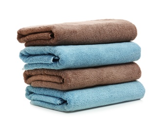 Photo of Stack of clean folded towels on white background