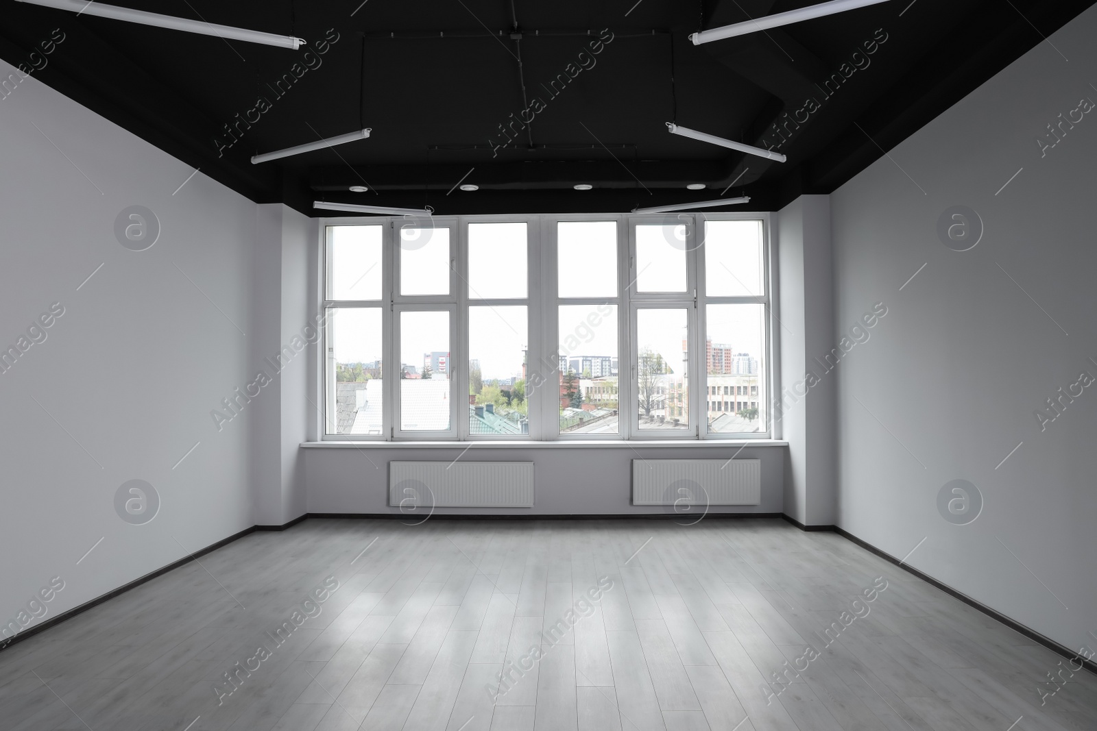 Photo of Modern office with white walls and window. Interior design