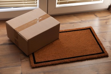 Photo of Parcel on mat near front door indoors