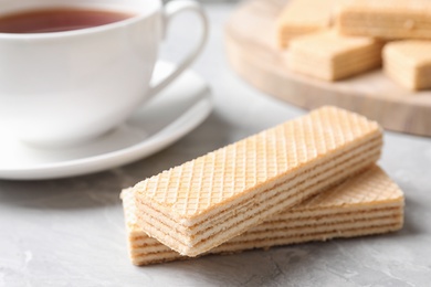 Delicious cream wafers on light grey marble table, closeup