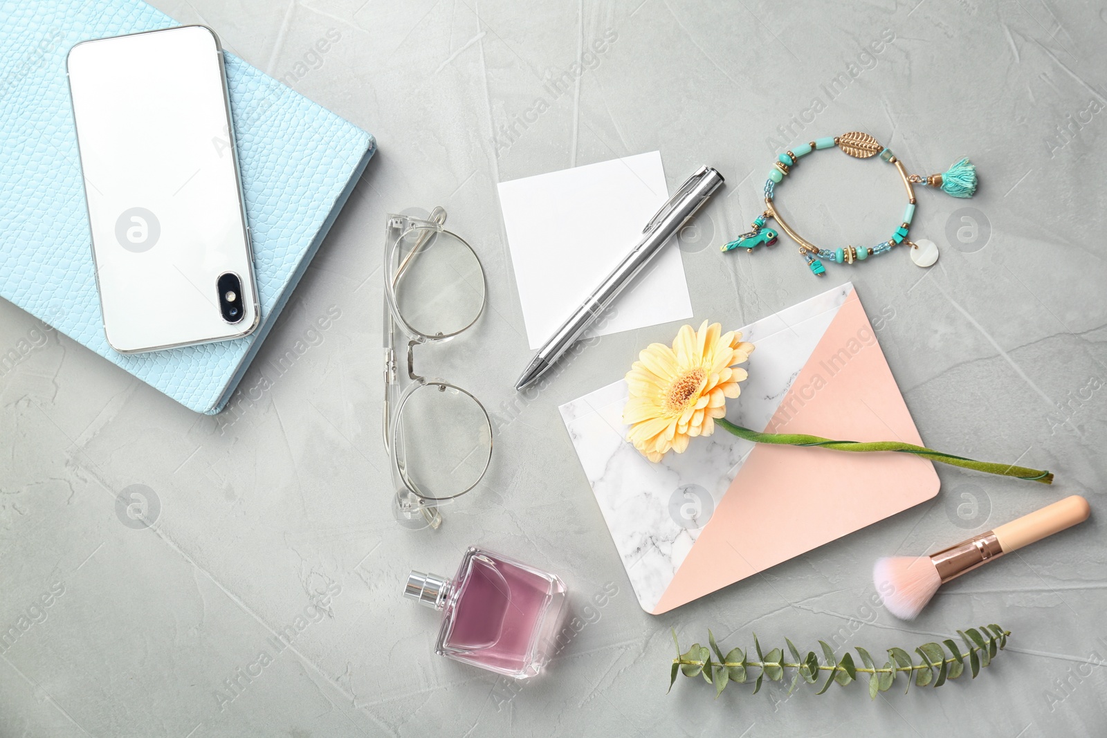 Photo of Flat lay composition with smartphone and stylish accessories on light background. Blogger concept