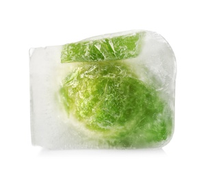 Photo of Brussels sprouts in ice cube on white background. Frozen vegetables