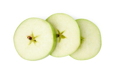 Photo of Slices of ripe green apple isolated on white, top view