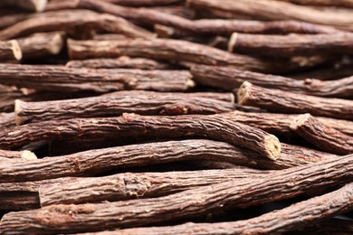 Dried sticks of liquorice root as background, closeup