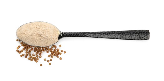 Photo of Spoon of buckwheat flour and grains on white background, top view