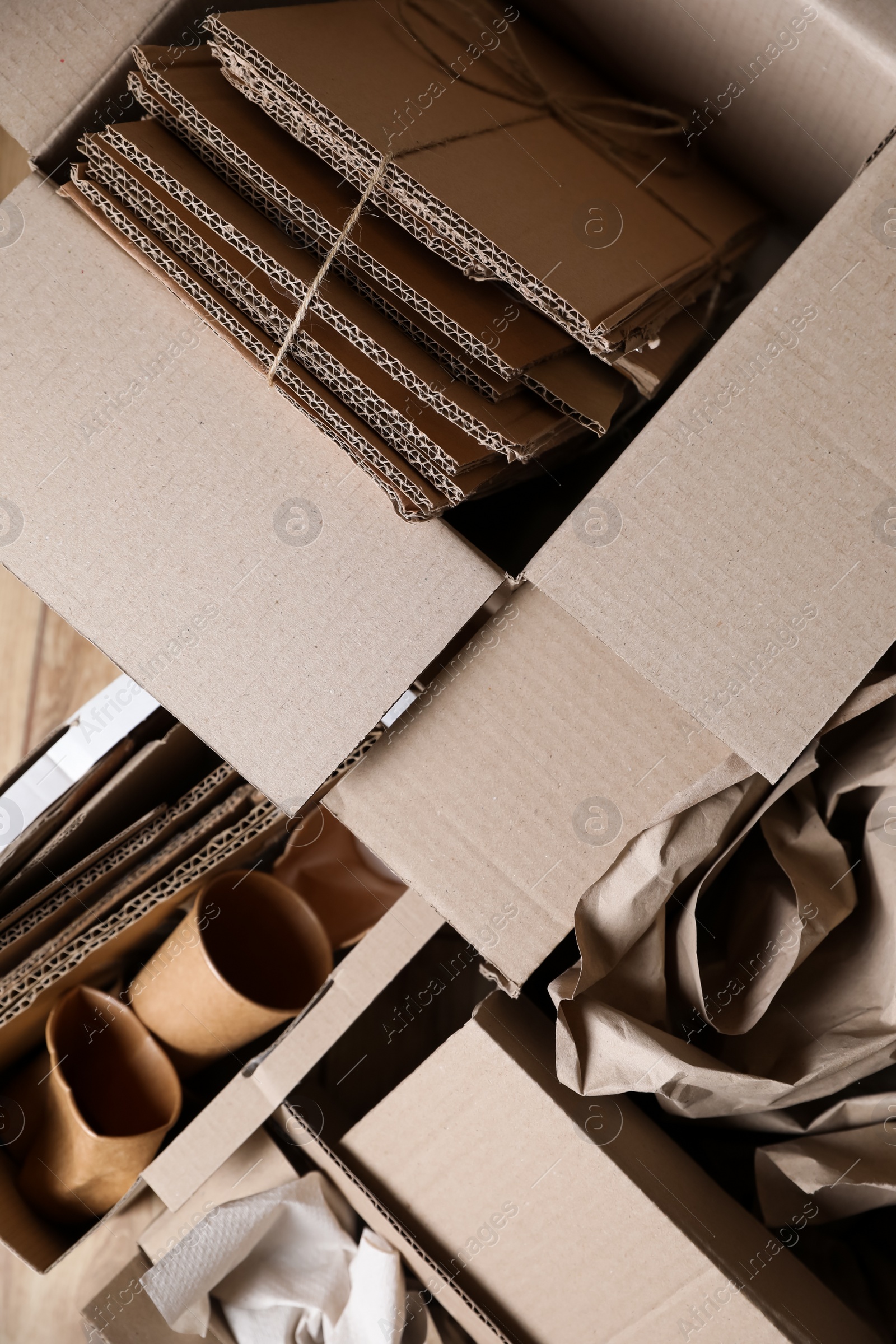 Photo of Different waste paper on wooden table, flat lay