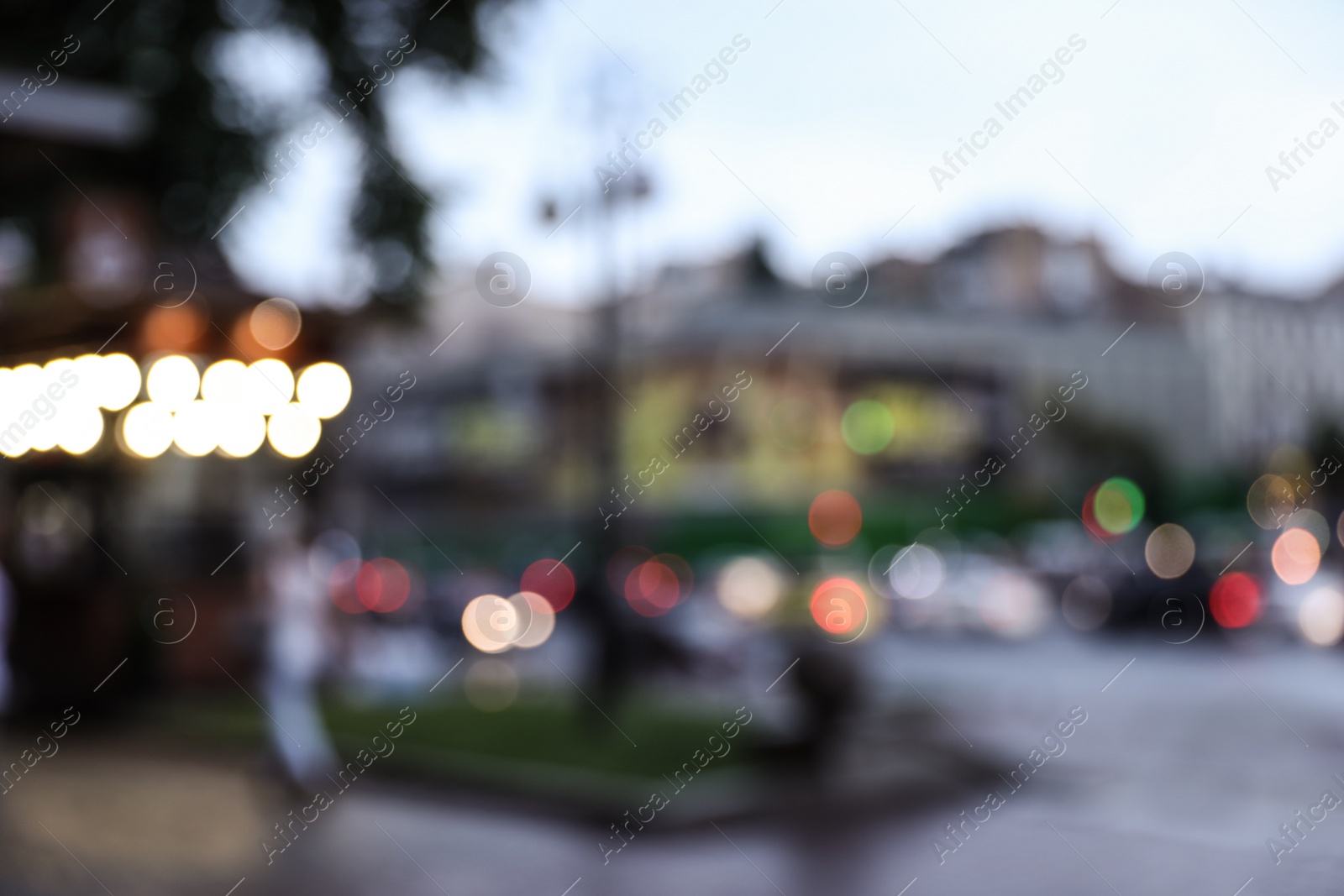 Photo of Blurred view of modern city at evening. Bokeh effect