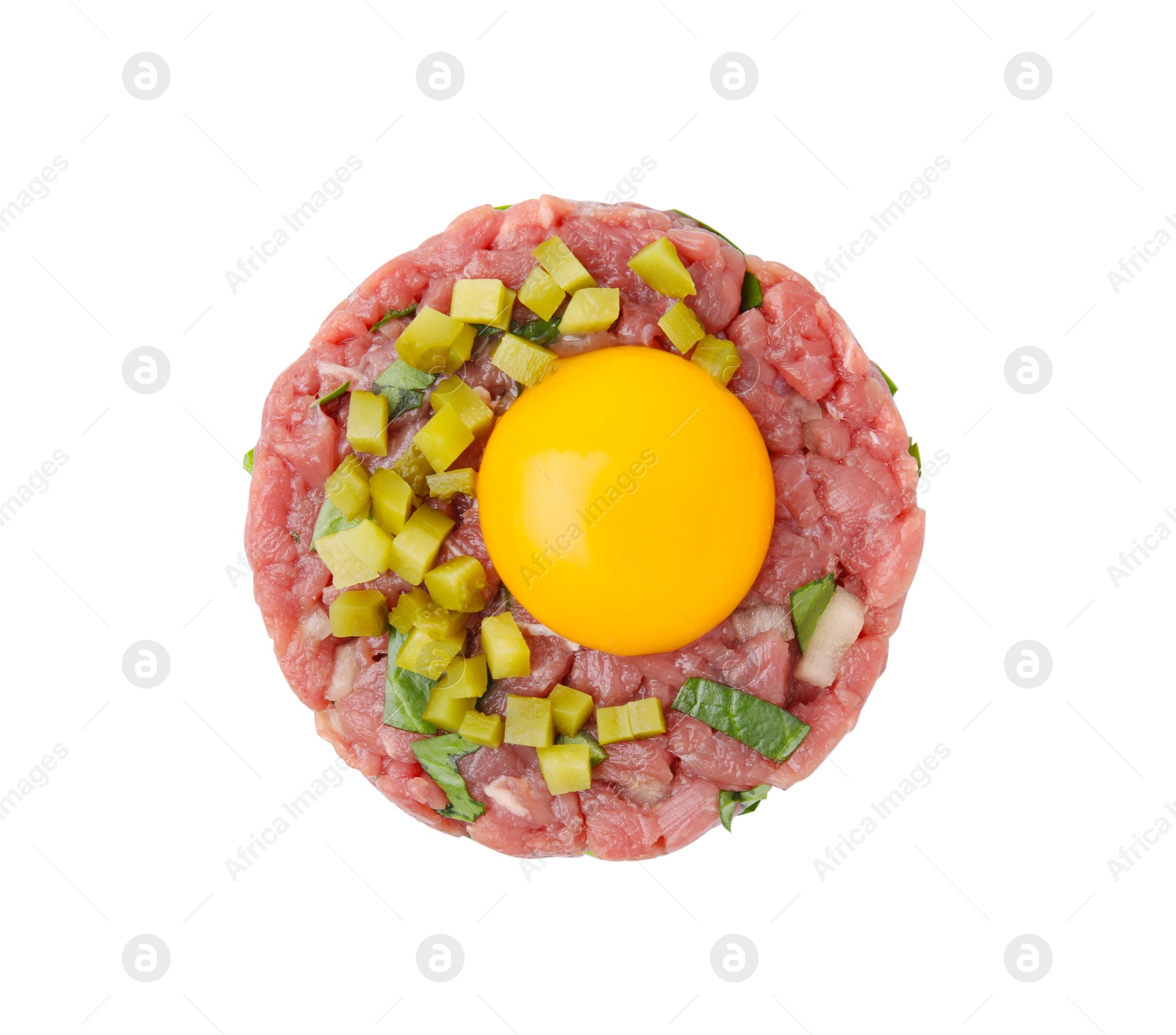 Photo of Tasty beef steak tartare served with yolk and pickled cucumber isolated on white, top view